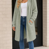 Manteau long femme à capuche en fausse peau lainée avec fermeture éclair