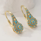 boucles d’oreilles fleurs turquoise plaquées or